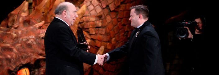 Mike Resnick presenting Sean Hazlett his Writers of the Future award Mike Resnick presenting Sean Hazlett his Writers of the Future award