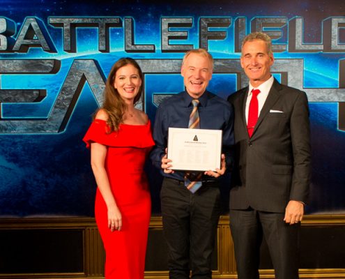 Emily Goodwin and John Goodwin present award to Jim Meskimen