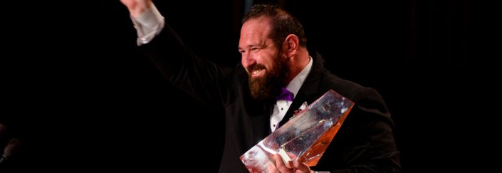Jake Marley on stage with the Golden Pen Award Jake Marley on stage with the Golden Pen Award