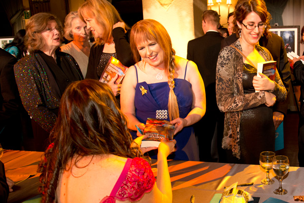 Writers of the Future Judge Rebecca Moesta getting her book signed by one of the new writer winner Writers of the Future Judge Rebecca Moesta getting her book signed by one of the new writer winner