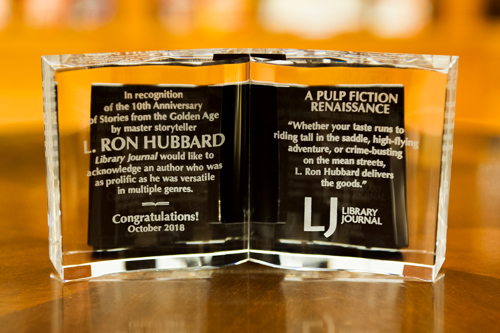 Library Journal Magazine honors L. Ron Hubbard with crystal book on the 10th-anniversary of the Stories from the Golden Age